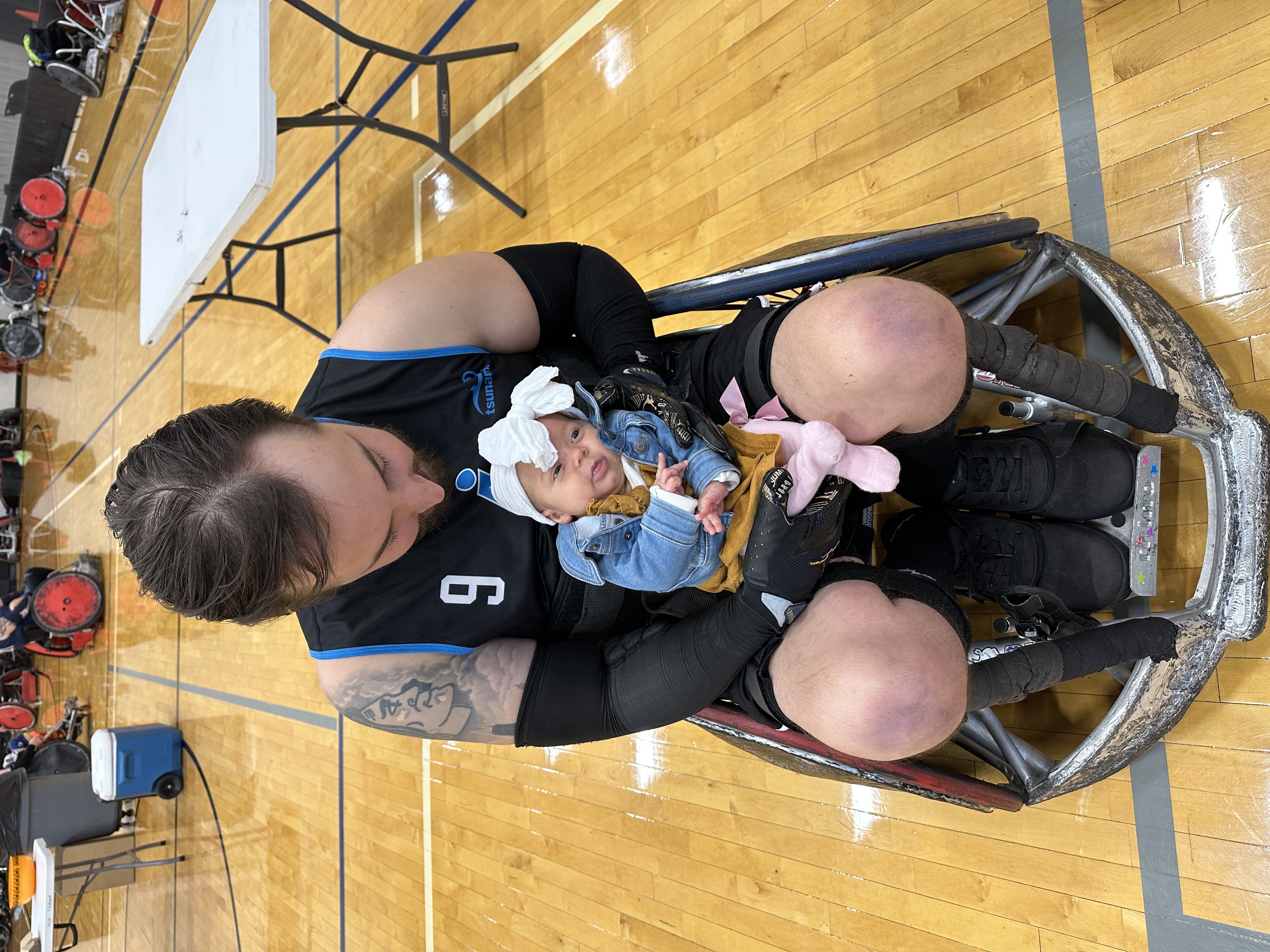 Mitch holding his baby